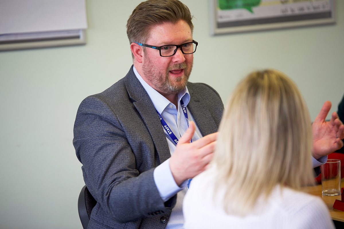 Discussion between two teachers.