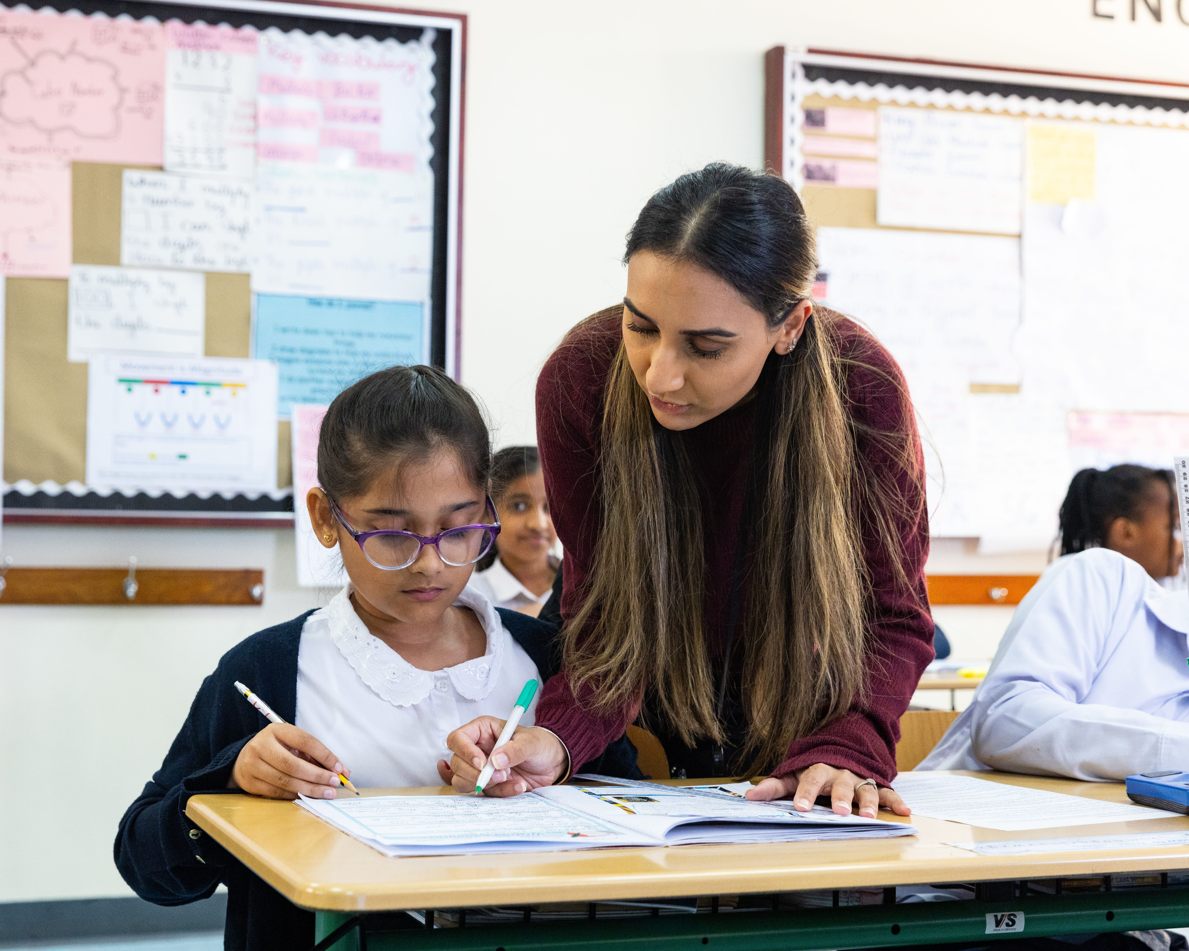 Mesaieed International School teacher and pupil