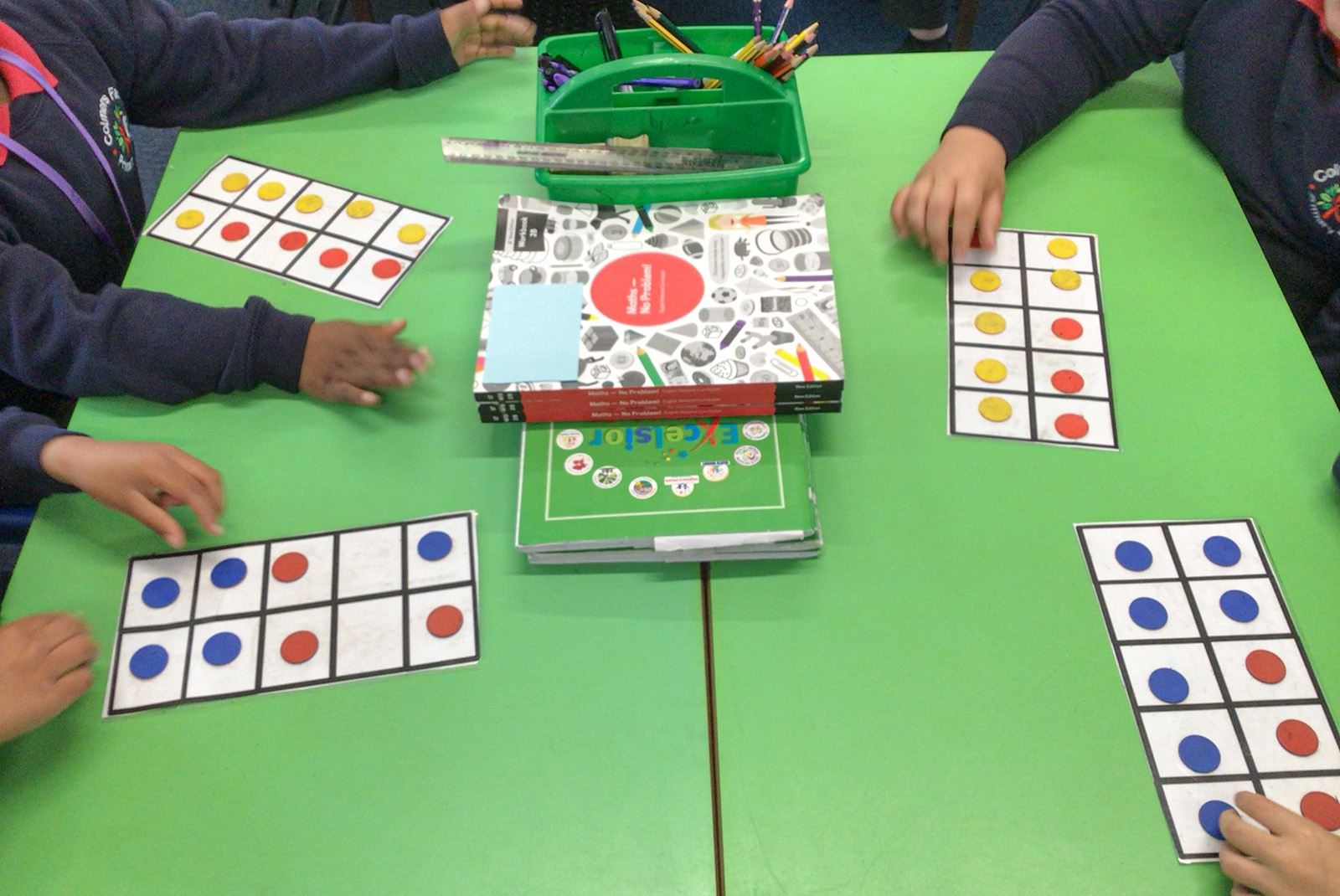 Children using tens frames and Maths — No Problem! textbooks
