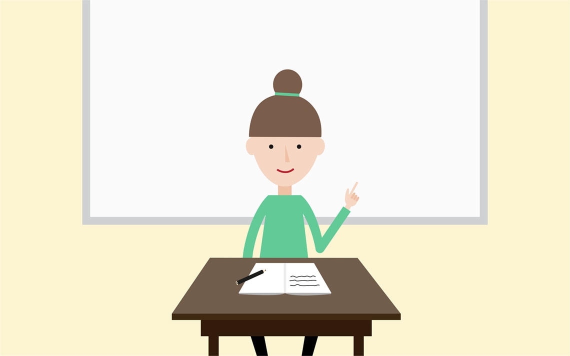 A maths teacher at the front of her class giving a lesson in front of a whiteboard