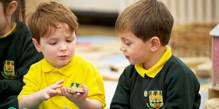 Maths mastery pupils discussing manipulatives together.