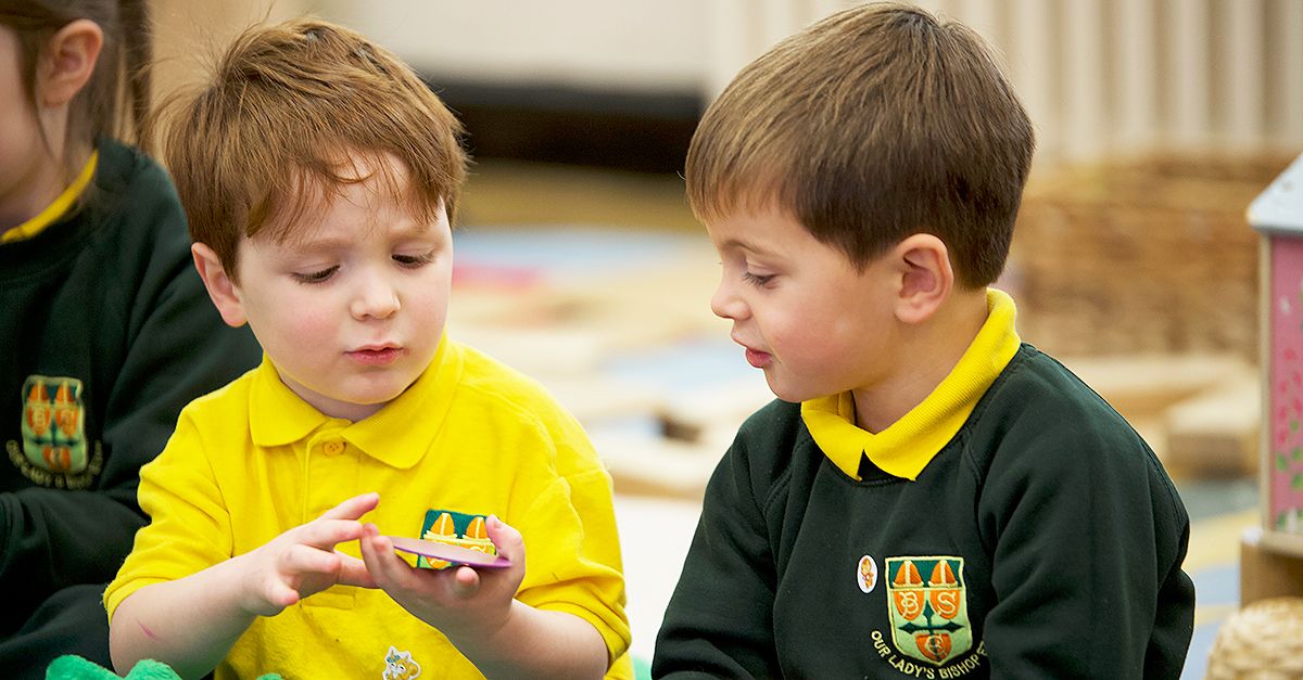 Maths mastery pupils discussing manipulatives together.