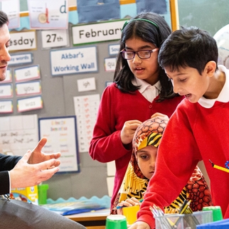 primary maths teacher with students