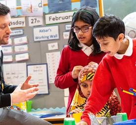International teacher teaching maths mastery to primary school students