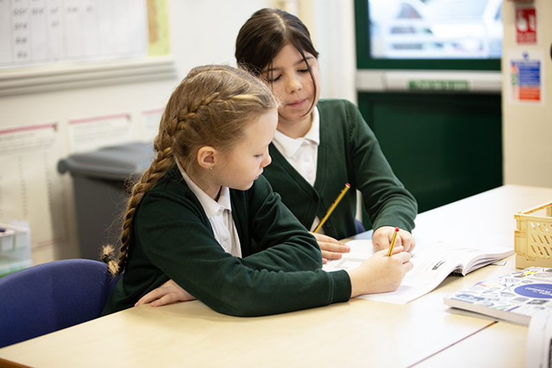 Two girls working on maths together