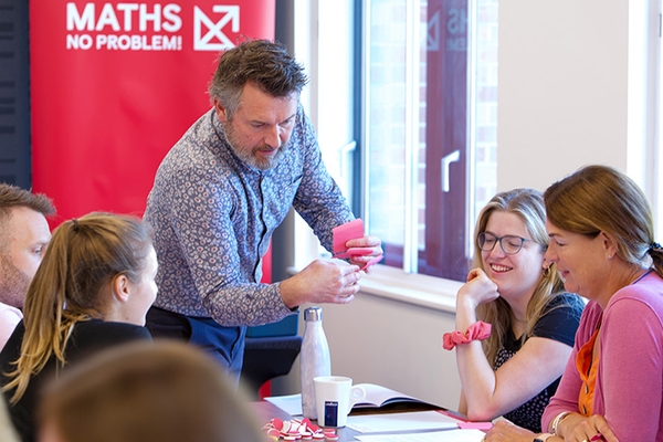 Adam Gifford speaking to a group of teachers
