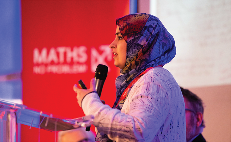 Rabia Ahmed from West Twyford primary school presenting on stage at the Maths Mastery in a Post-Pandemic World Conference.