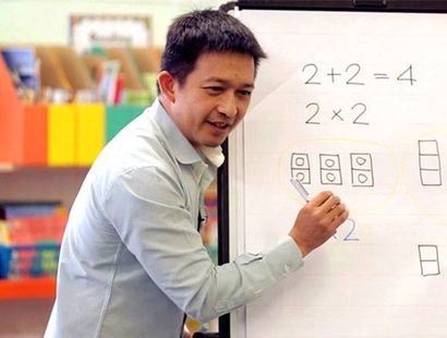 Singapore maths teacher Dr. Yeap Ban Har teaches a lesson to children