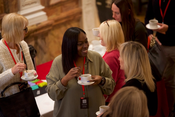 delegates mingling during morning coffee