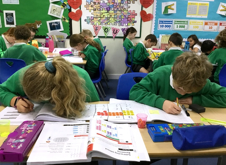 Liphook pupils working on Maths — No Problem! textbooks at their desks