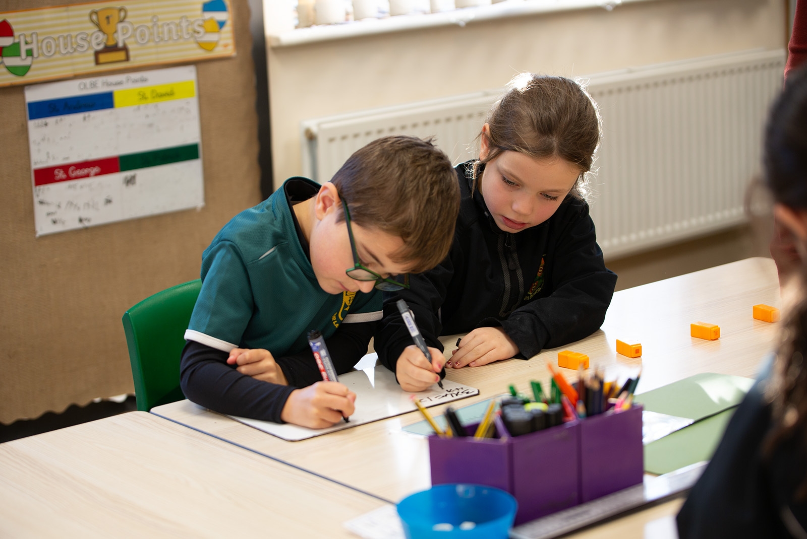 Two pupils with a mini whiteboard