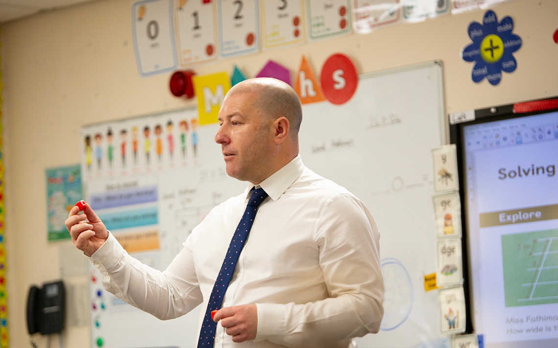 Matt Bland from Our Lady's Bishop Eton Catholic Primary School teaching mathematics in the classroom.