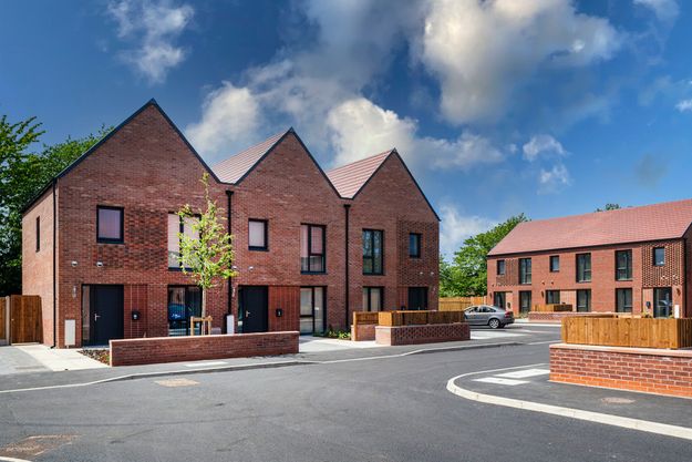 Passivhaus homes on a bright day