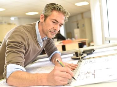 Architect drawing a house