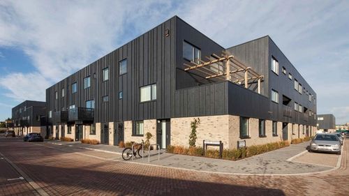 Apartments with black timber and brick cladding