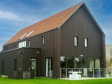 large timber clad barn style