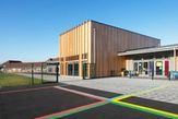 Timber frame school building on a sunny day