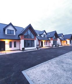 Row of 4 contemporary house designs with large gable windows
