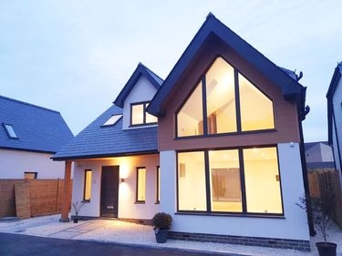 Contemporary house design with large gable windows