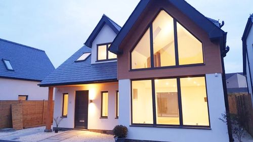 Contemporary house design with large gable windows