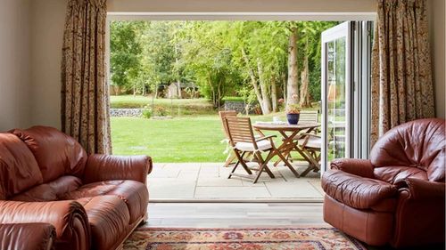 living space with bi-fold doors into garden