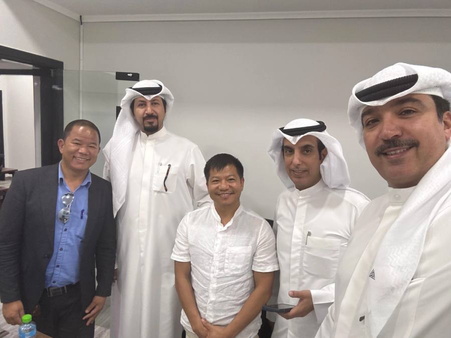 With our partners in Kuwait