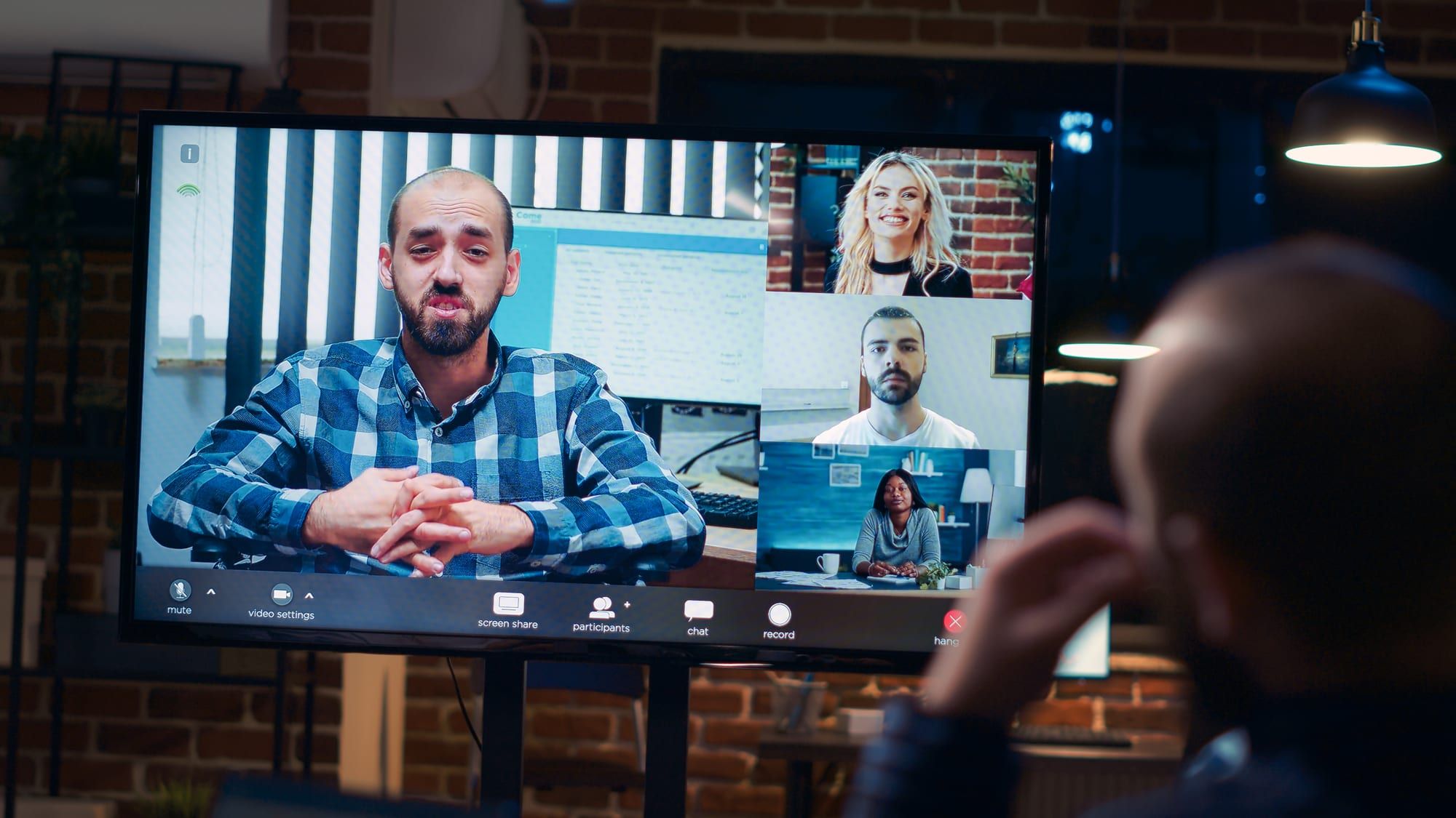 A video call on a large screen, keeping in touch with people abroad