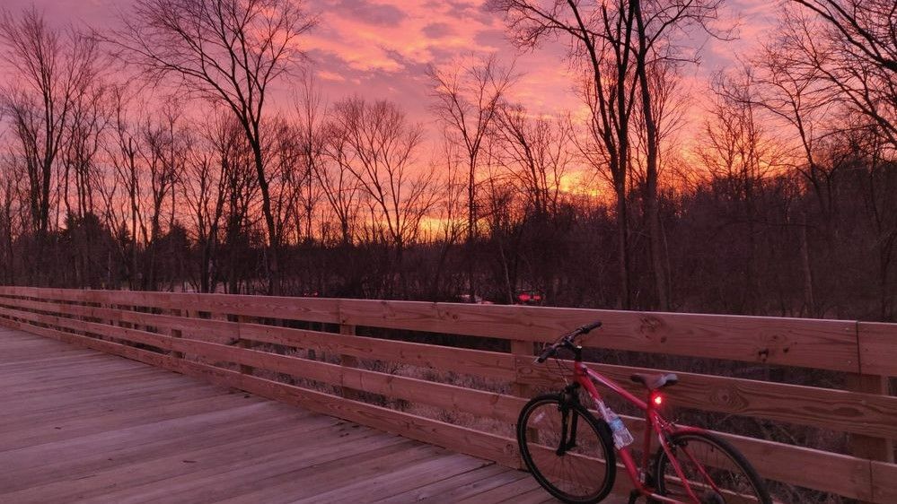 Sunset taken from a boardwalk with a bike