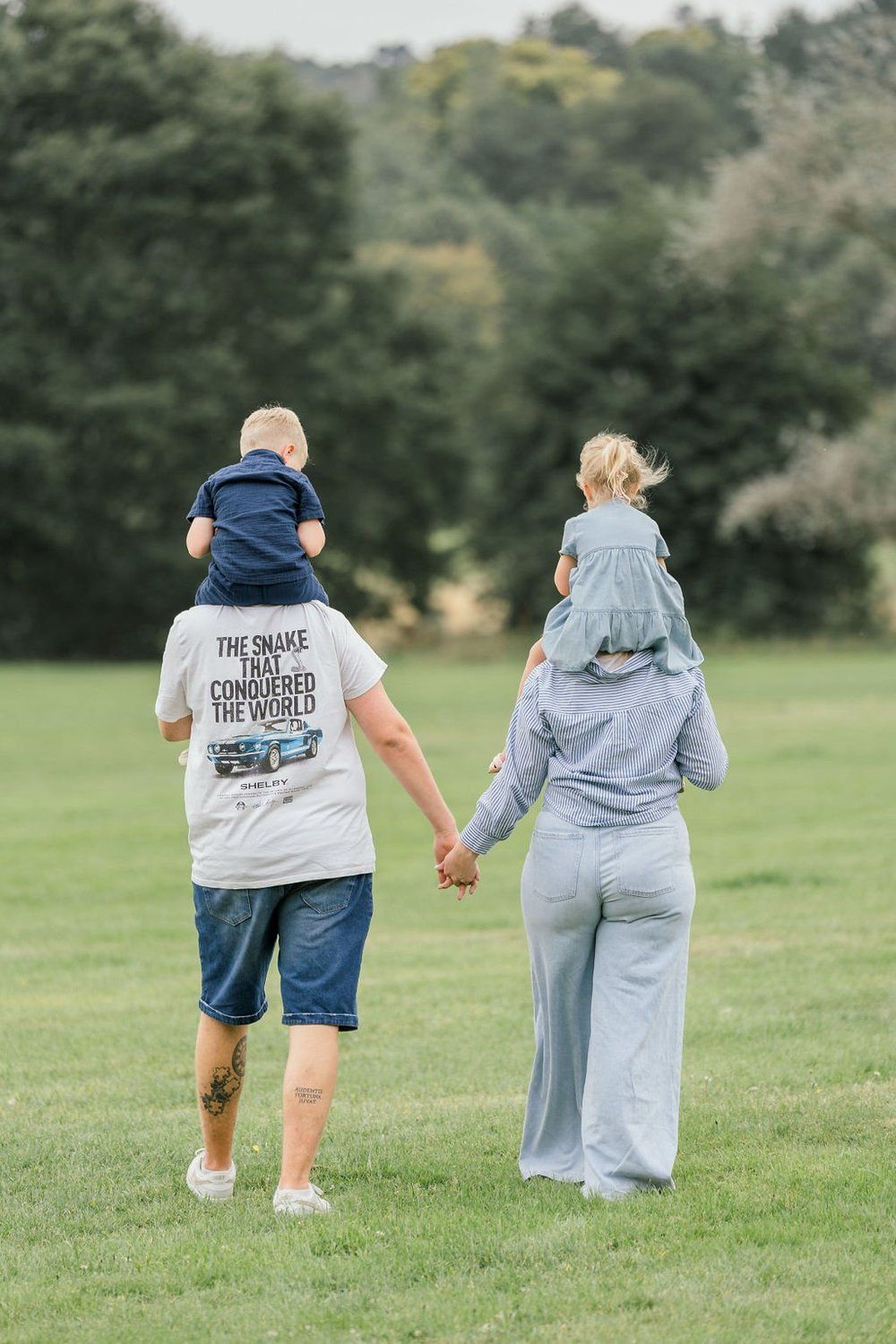 Family walking through a field