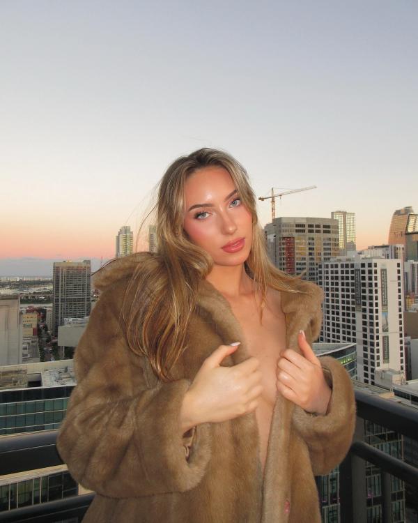 girl in fur coat in the city bella reid