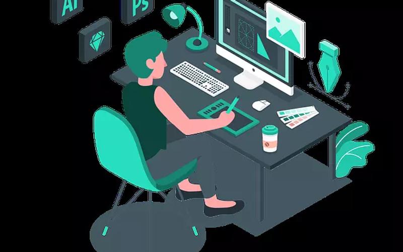 Web developer using design tools at a workstation.