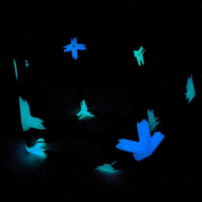 Lights out photo showing the glow-in-the-dark filament used to print the Rhombtron vertices