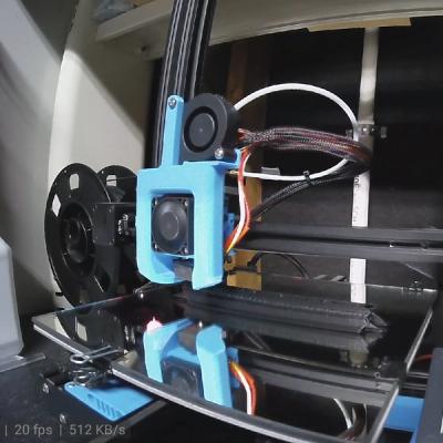 Webcam photo of in-progress edge component being 3D printed on an upgraded Ender-3