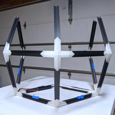 A partially assembled 3D-printed Rhombotron frame previewing the perspective looking at a 4-order vertex