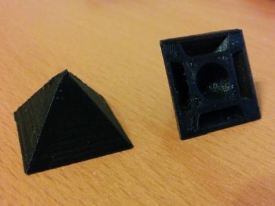 3D-printed vertex connectors in glossy black PLA, looking pointy AF