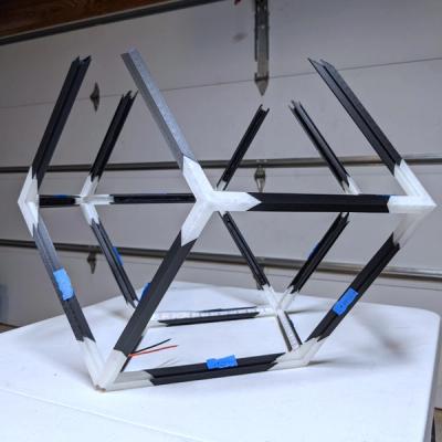 A partially assembled 3D-printed Rhombotron frame previewing the perspective looking at a 3-order vertex