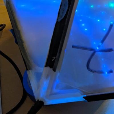 Close-up of the power input vertex with a DC barrel jack plugged in