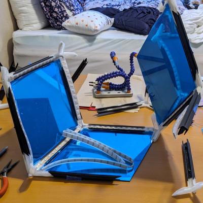 A partially assembled Rhombotron frame with the first three acrylic rhombuses and ten LED segments installed