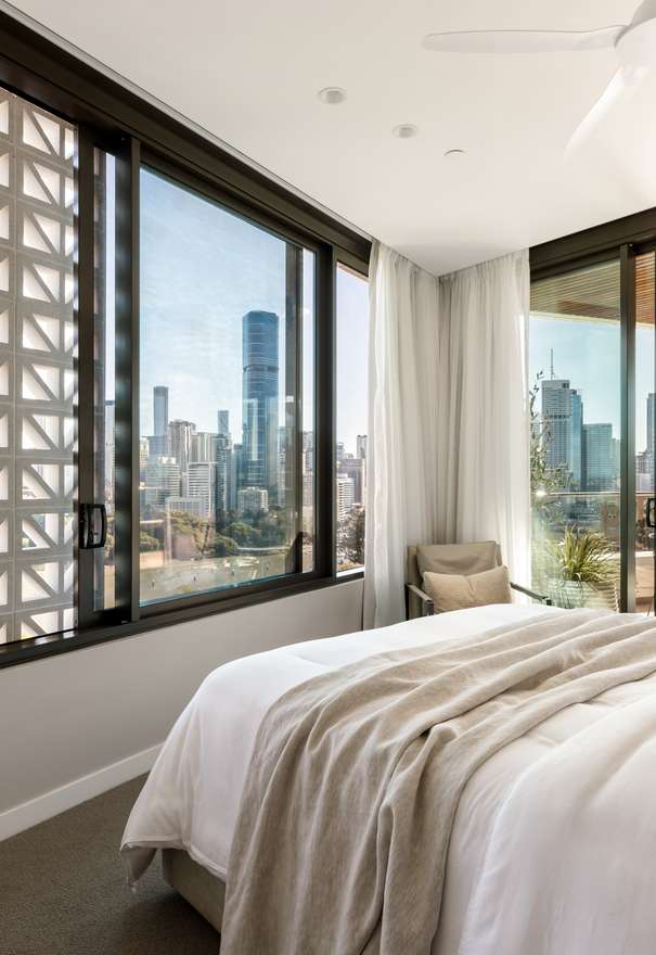 Riviere by Aria, luxury apartment bedroom overlooking Brisbane river and city.