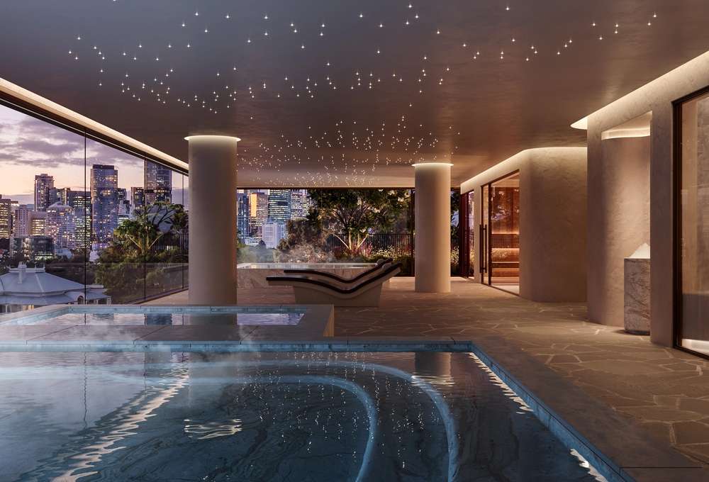 The Wellness Club, including a luxury sauna and steam room at Cliff by Aria in Brisbane, featuring stone finishes, landscaped gardens, and panoramic city views from the wellness retreat.