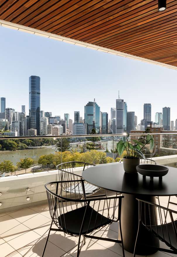 Riviere by Aria, luxury apartment balcony overlooking Brisbane river and city.