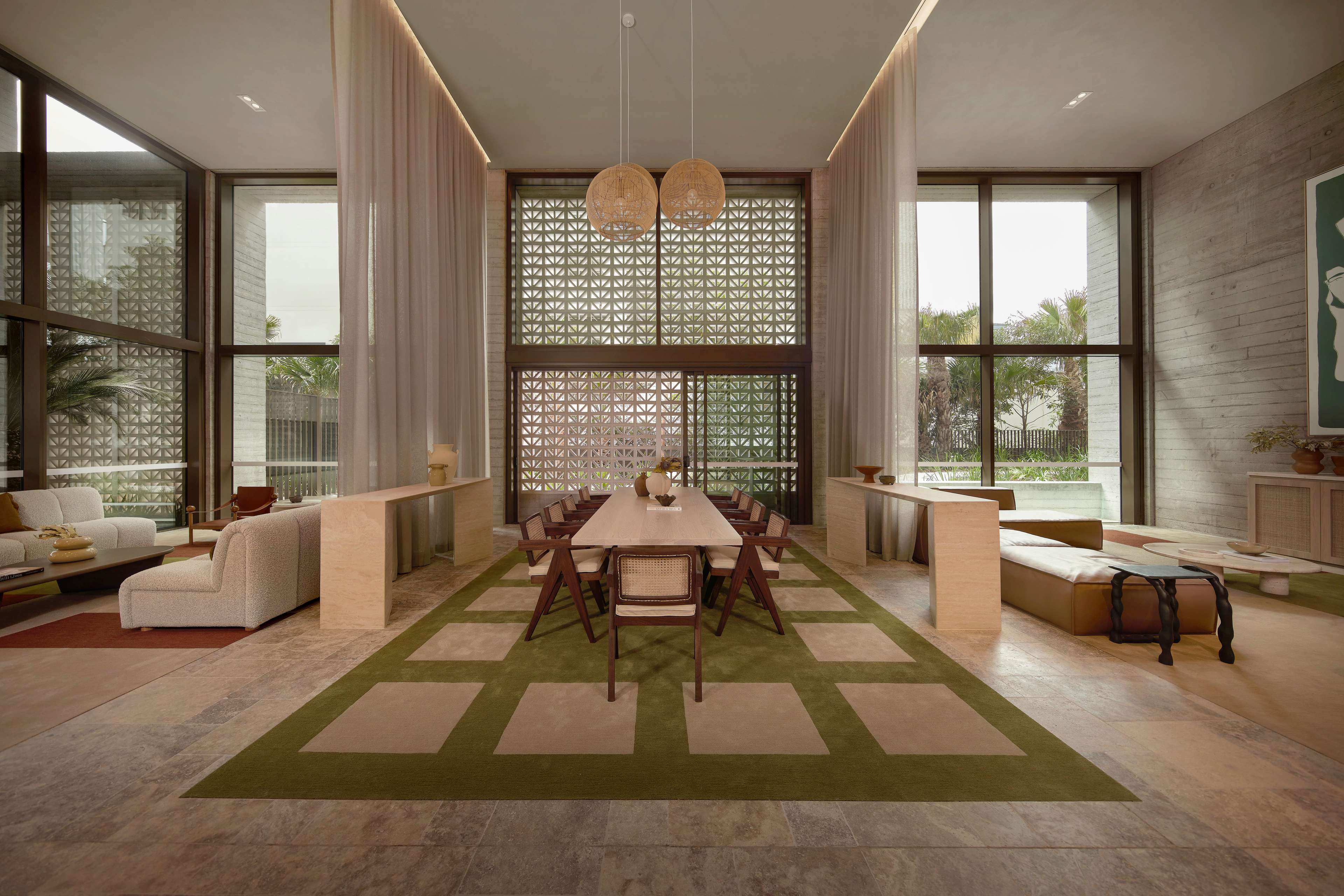 Double-height residents' lounge and dining space at Rivière by Aria