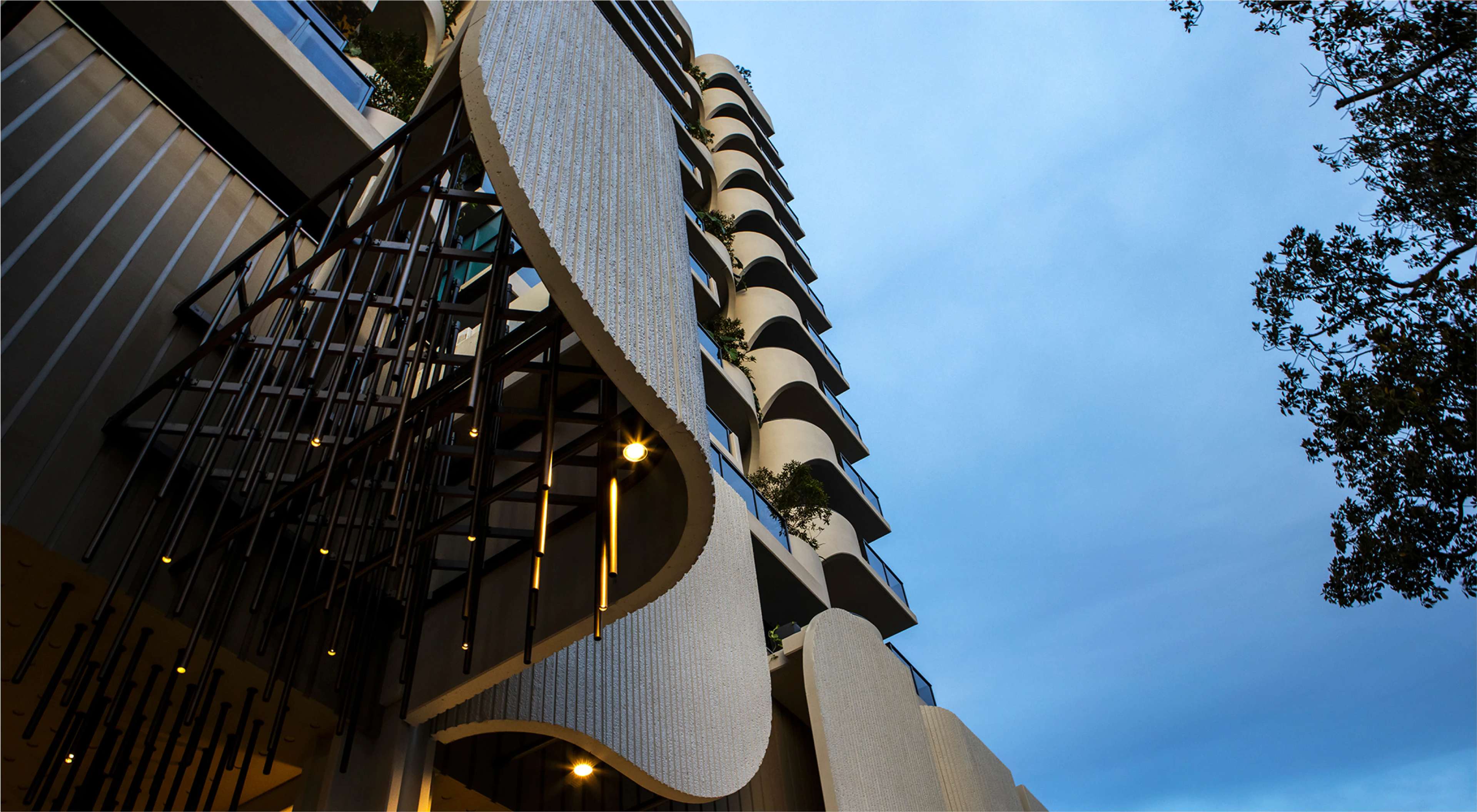 Inspired by the leafy and tranquil suburb of West End, TreeHouse by Aria is a luxury apartment development that merges lush greenery with an architecturally striking form.