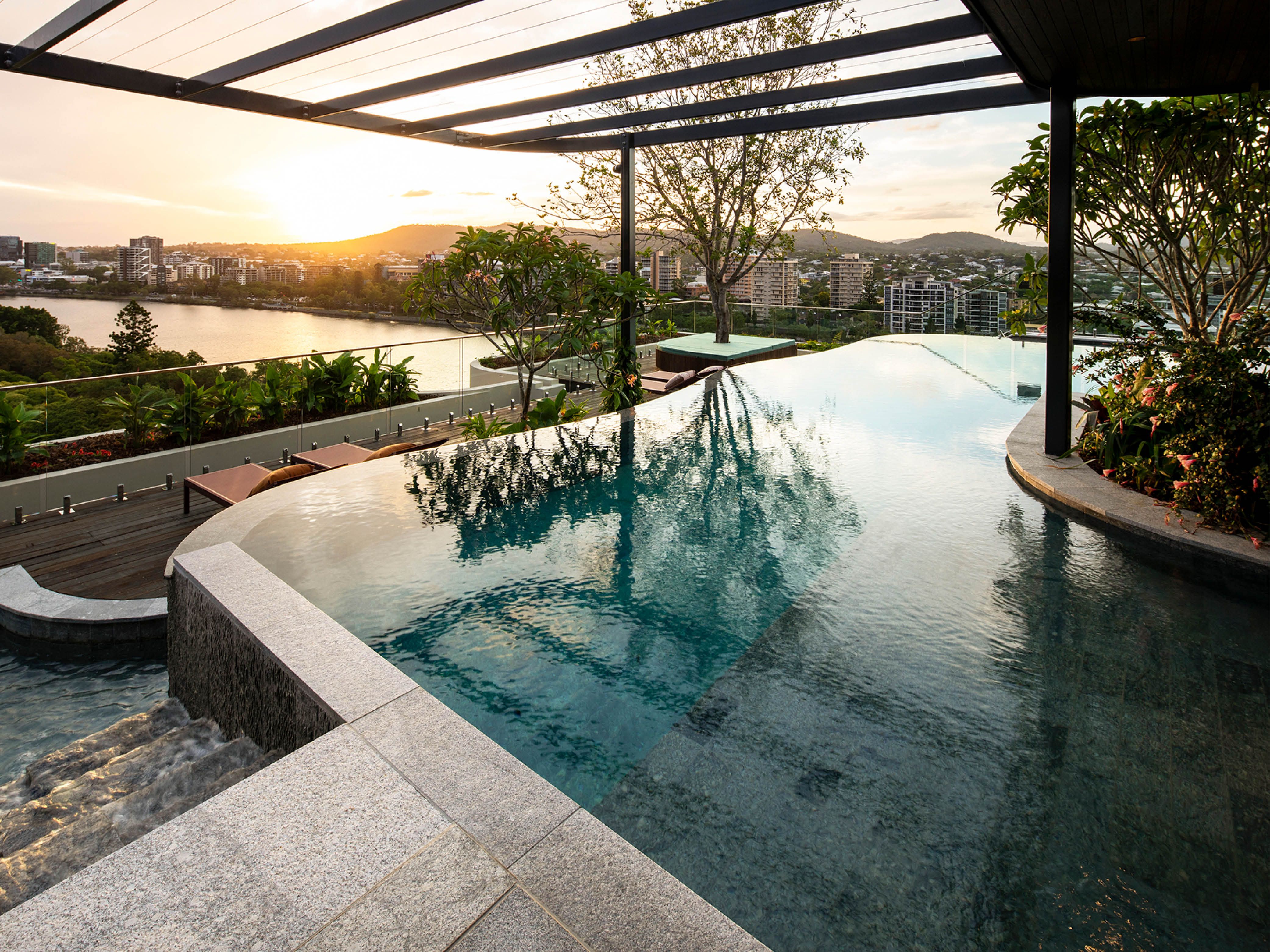 TreeHouse by Aria, luxury apartment rooftop swimming pool with views of Brisbane city.