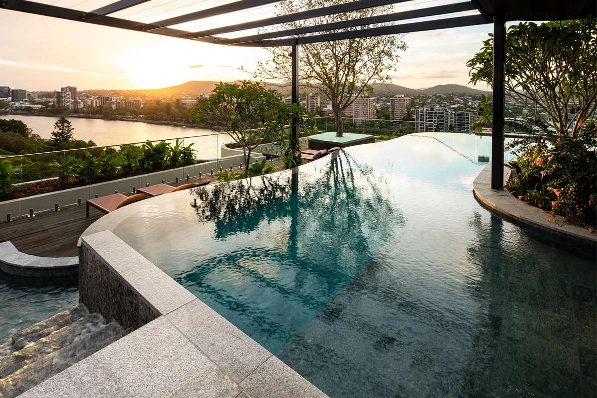 TreeHouse by Aria, luxury apartment rooftop swimming pool with views of Brisbane city.