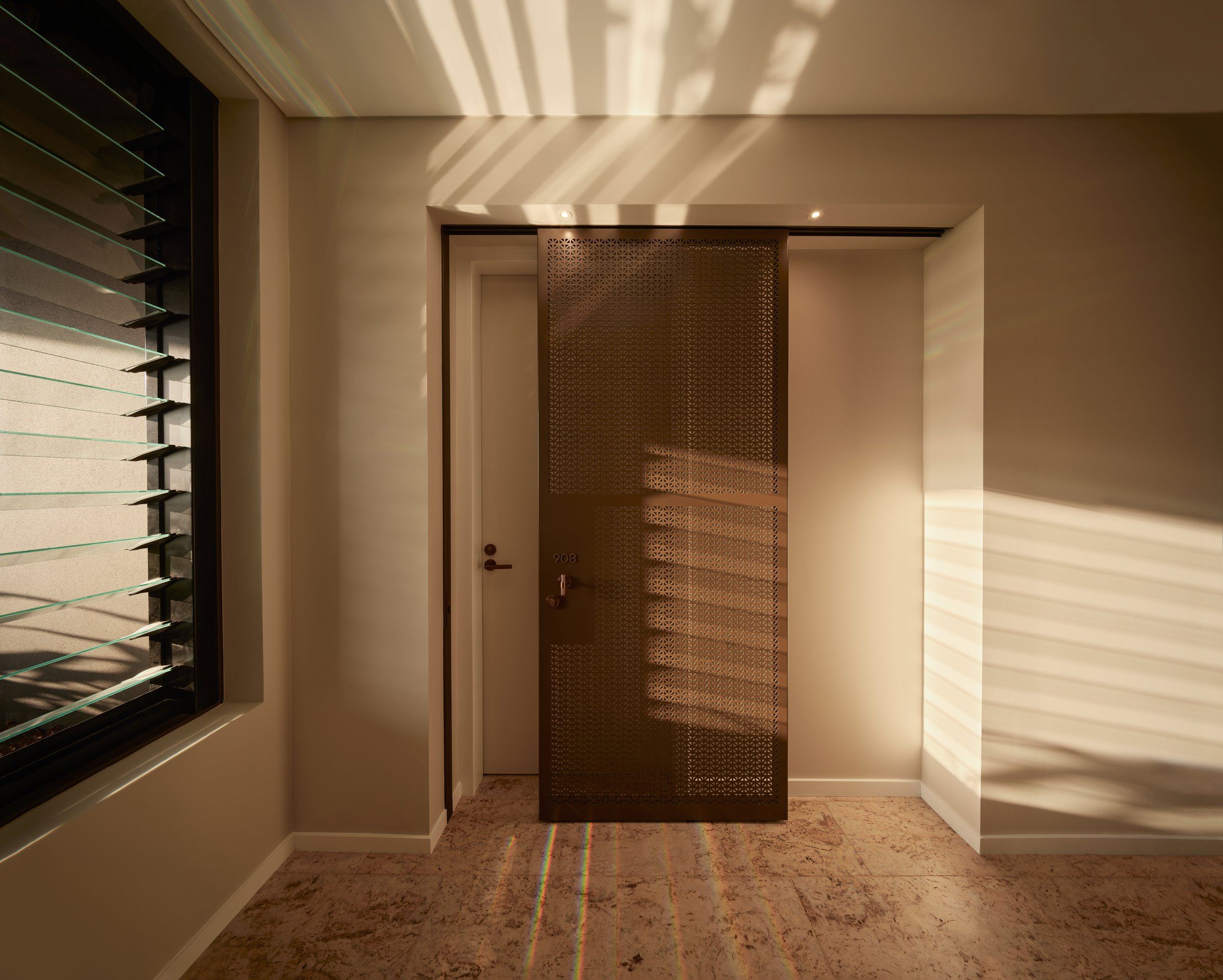 Architecturally designed screen door to a residence at Rivière by Aria