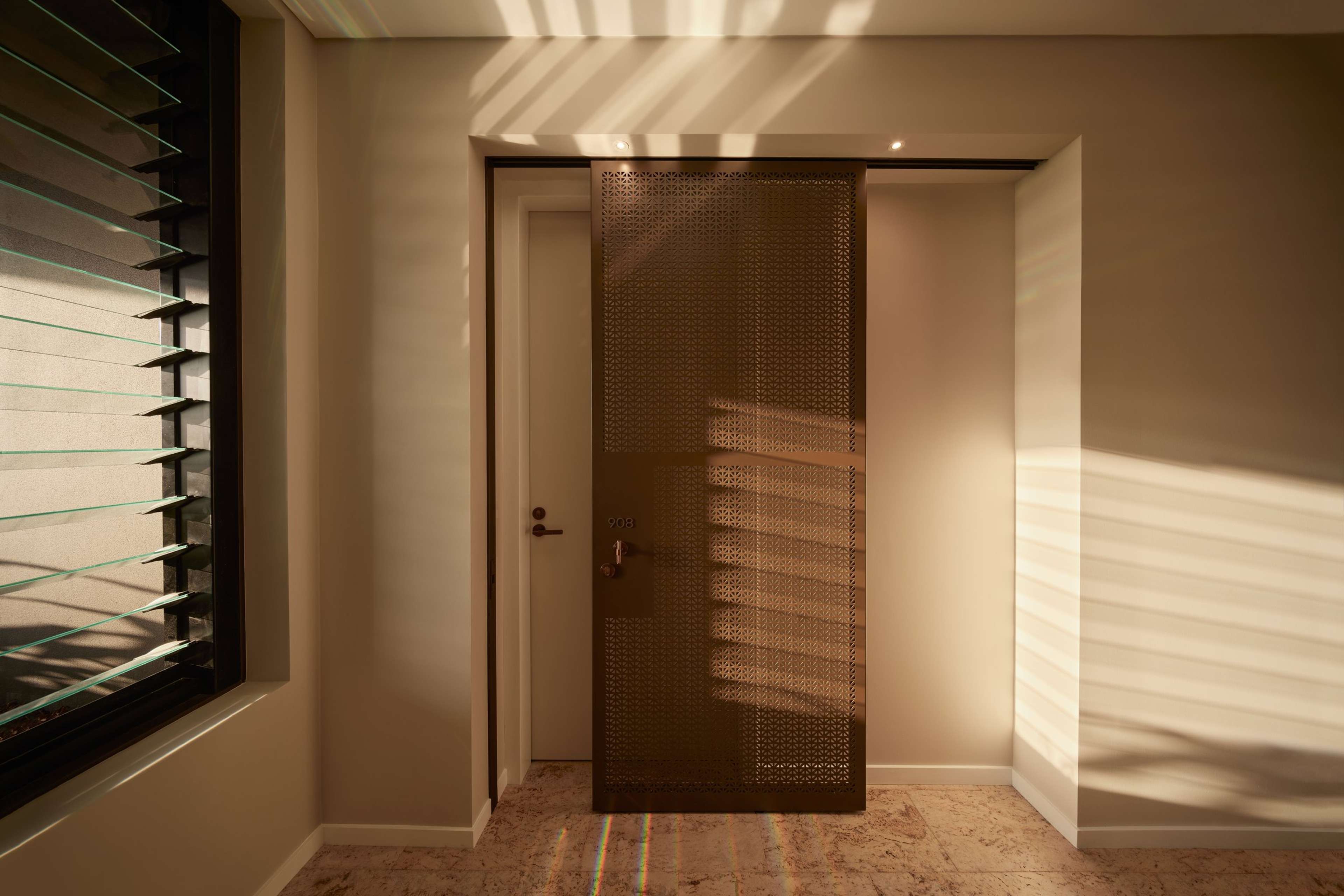Architecturally designed screen door to a residence at Rivière by Aria