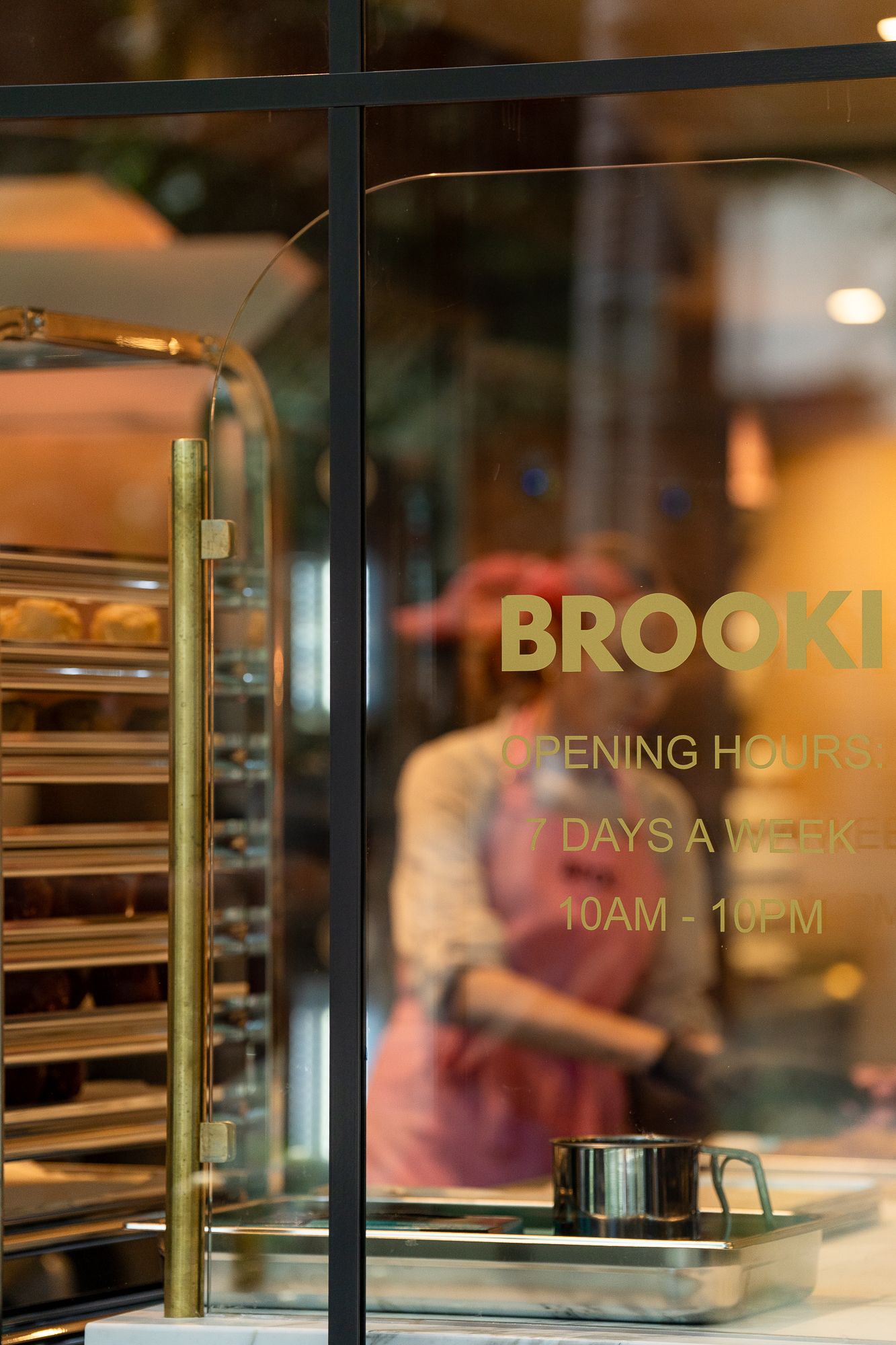 A Brooki baker seen through the theatre kitchen glass