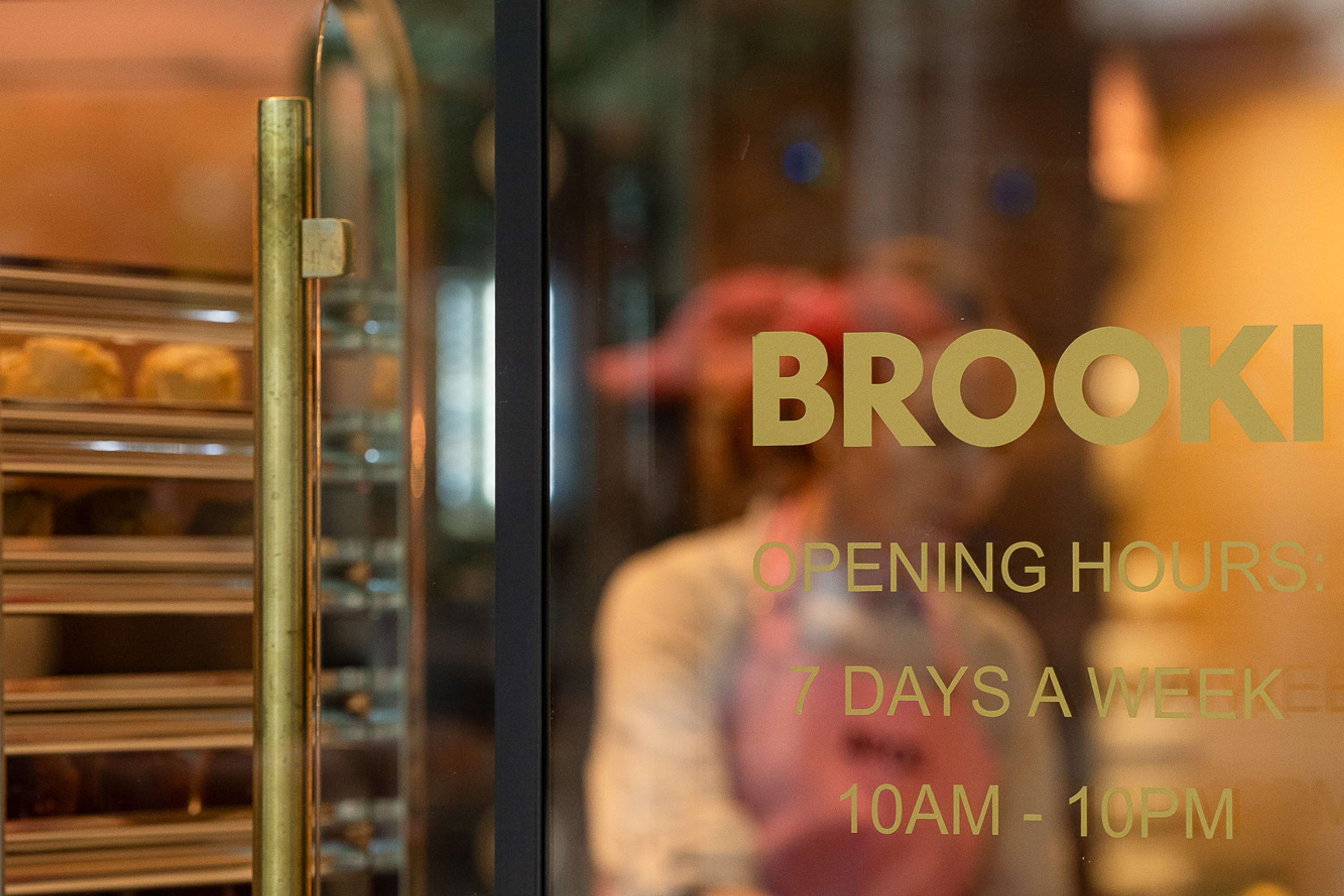 A Brooki baker seen through the theatre kitchen glass