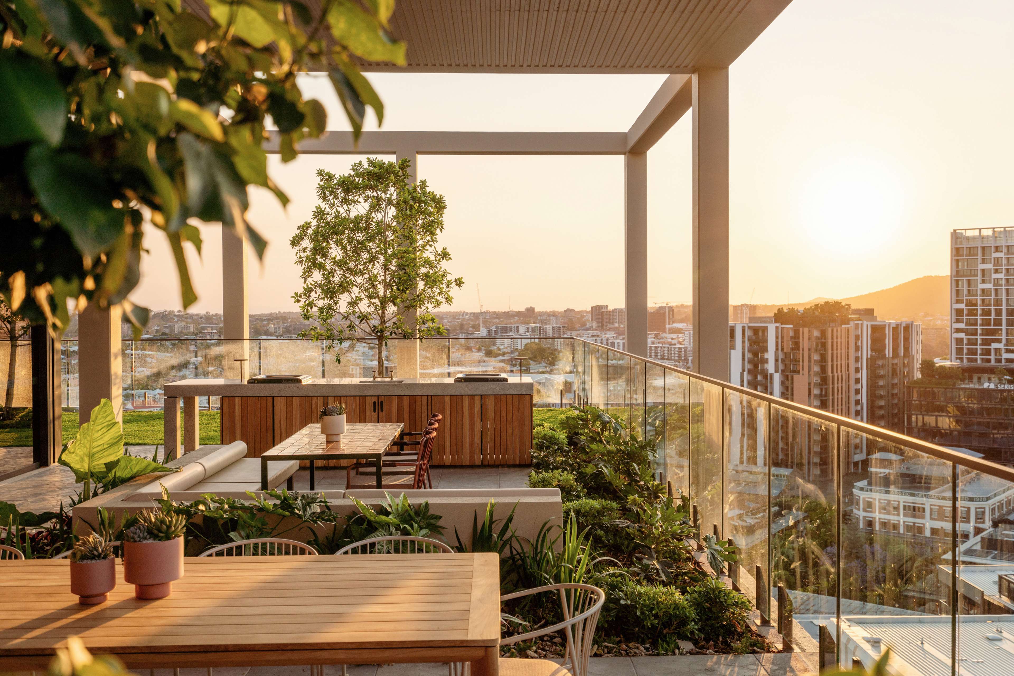Rooftop dining terrace at sunset at Trellis by Aria